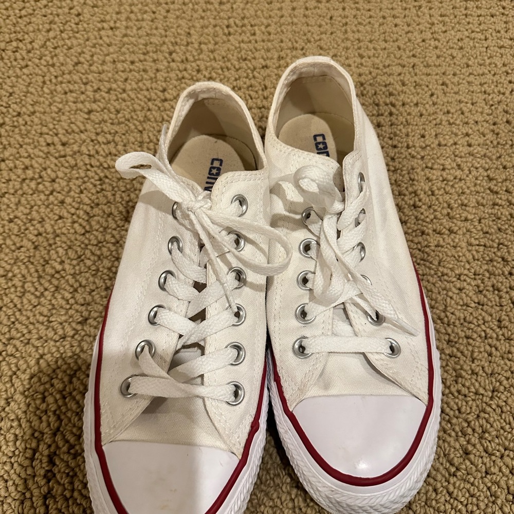 Brand new! White converse low tops. Women’s size 7.5